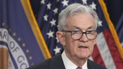 The Fed just raised its forecast for the economy. Its chair sees risk in strikes, surging oil.