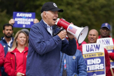 Biden urges striking auto workers to 'stick with it' in picket line visit unparalleled in history