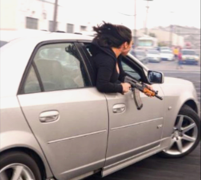 Arrest tied to viral 2021 photo of woman flashing AK-47 in San Francisco