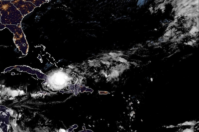 Tropical Storm Oscar dumps heavy rain on Cuba as it heads toward the Bahamas