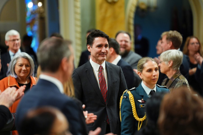 Canada's Trudeau reshuffles his Cabinet as resignation calls mount and new election threat looms