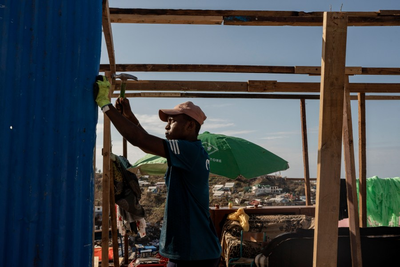 Crowds in Mayotte vent frustration with cyclone response as Macron tours devastation