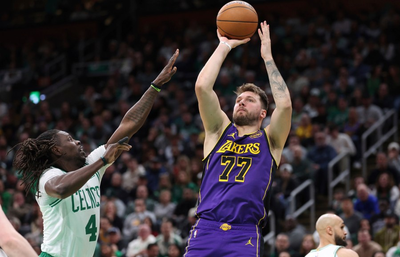 Tatum scores 40, Celtics beat Lakers 111-101 after James leaves late with groin injury