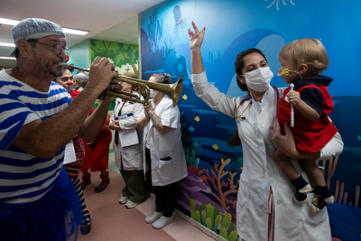 Clowns and musicians bring the joy of Carnival to sick children in a Rio hospital