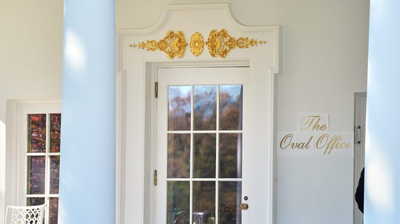 Trump adds gold-script signage outside of Oval Office