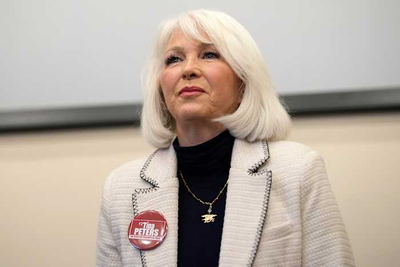 Colorado's Democratic governor commutes ex-election clerk Tina Peters' sentence after Trump pressure