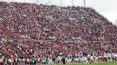 Skydiver's parachute gets stuck on scoreboard at Virginia Tech spring game in harrowing scene