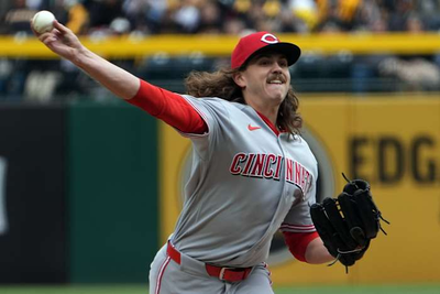 The Reds tie an MLB record by walking 7 straight batters in a 17-7 loss to the Pirates