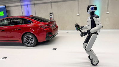 BMW puts humanoid robots to work building EVs