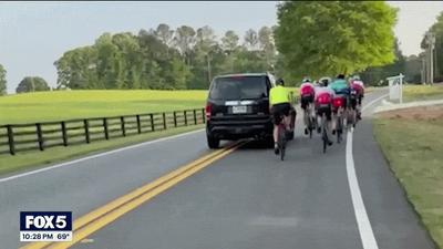 WATCH: Driver smirks in mugshot after allegedly hitting group of cyclists in caught-on-camera road rage