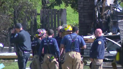 Small plane crashes into Ohio home killing 2 on board, igniting blaze in residential area