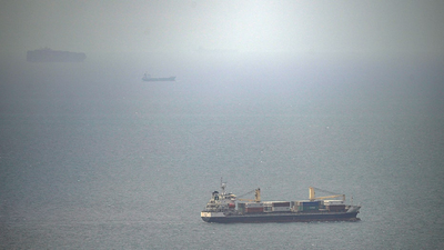 Cargo ship attacked by small craft near Strait of Hormuz, UK maritime agency says