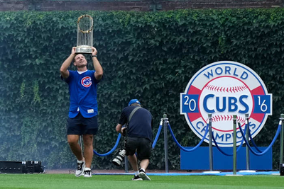 Former Cubs player Anthony Rizzo snares Michael Busch's home run ball in the Wrigley Field bleachers
