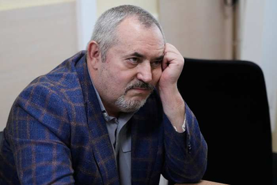 A Putin critic is convicted on charges that will keep him from campaigning for Russia's parliament