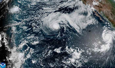 Major hurricane Genevieve roars in the Pacific as Hurricane Fausto nears Hawaii