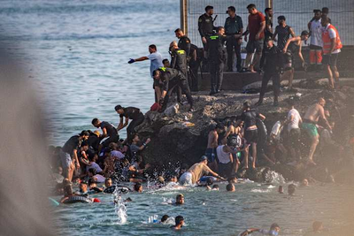 Spain deploys military to Ceuta after thousands of people breach Morocco’s border and at least 9 die