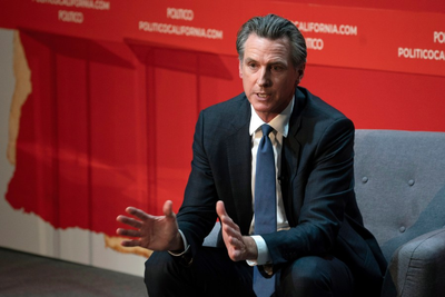Newsom signs law to slowly raise health care workers’ minimum wage to $25 per hour