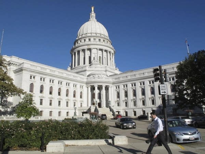 Man faces misdemeanor charge for twice bringing guns to Wisconsin Capitol, demanding to see governor