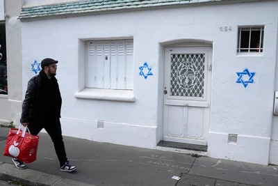 France blames Russia for a digital effort to whip up online controversy over Stars of David graffiti