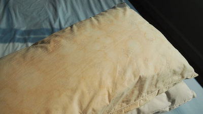 People are divided online over whether it’s gross to sleep on stained, yellowing pillows