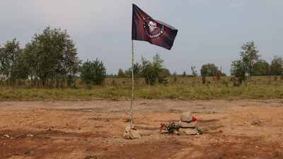 Wagner Group flag seen flying at Prigozhin crash site in Russia