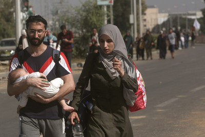 Civilians fleeing northern Gaza's combat zone report a terrifying journey on foot past Israeli tanks