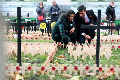 Somber bugles and bells mark Armistice Day around the globe as wars drown out peace messages