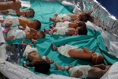 Medics and patients, including babies, stranded as battles rage around Gaza hospitals