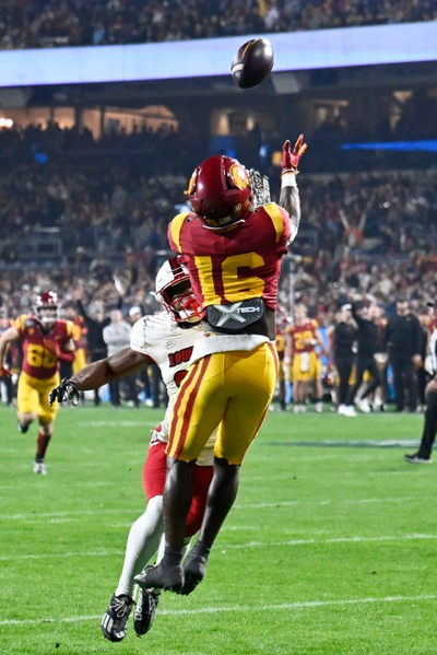 USC's Moss throws Holiday Bowl-record 6 TD passes in 42-28 victory over No. 16 Louisville