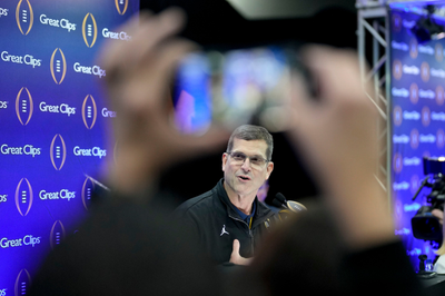 Harbaugh's future at Michigan is subplot to CFP title game as Washington tries to lock up DeBoer