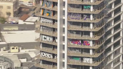 Taggers vandalize 27 floors of luxury Los Angeles high-rise left abandoned by Chinese developers