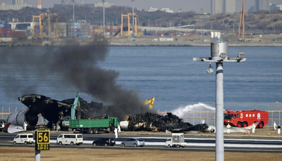 Japanese air safety experts search for voice data from plane debris after runway collision