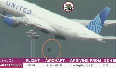 United flight diverted after tire falls off during takeoff, strikes parked cars