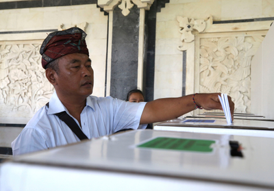 Millions of Indonesians choose a new president in one of the world's largest elections