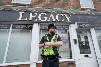 Police remove 34 bodies from English funeral home and arrest 2 for fraud and preventing burial