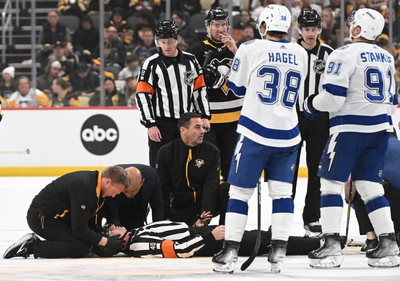 Referee taken off ice on stretcher after collision with Lightning's Haydn Fleury