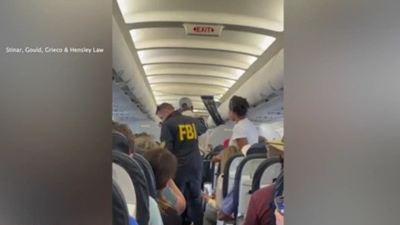 Video released: Terrell Davis handcuffed, removed from United flight